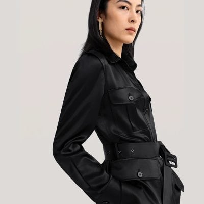 Elegant black leather trench coat with a belted waist, perfect for stylish and sophisticated fashion. Ideal for those seeking luxury outerwear for everyday wear or special occasions.