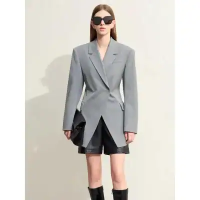 Powerful women’s fashion: stylish gray blazer, black shorts, and accessories at Monalisa Store for modern, confident looks. Perfect for professional and casual wear.