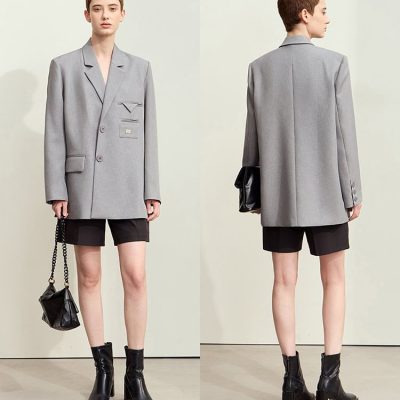 Gray oversized blazer with black shorts and ankle boots, styled for a modern yet sophisticated look at Monalisa Store. Perfect for fashion-forward individuals seeking chic, versatile wardrobe essentials.
