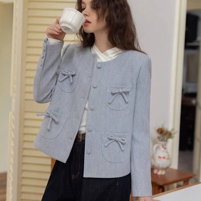 Elegant woman drinking coffee in a stylish outfit at Monalisa Store, showcasing high-quality fashion and accessories for a sophisticated look.