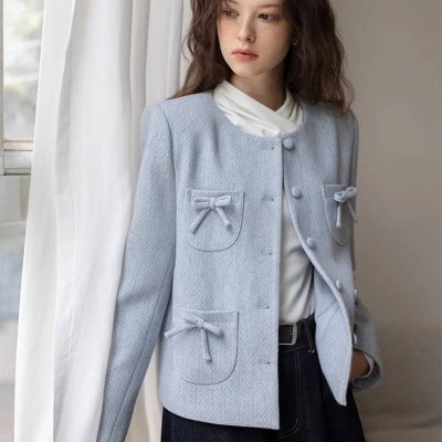 Elegant light blue tailored jacket with bow accents, perfect for fashionable women's wear at Monalisa Store. Ideal for stylish office or casual outfits.
