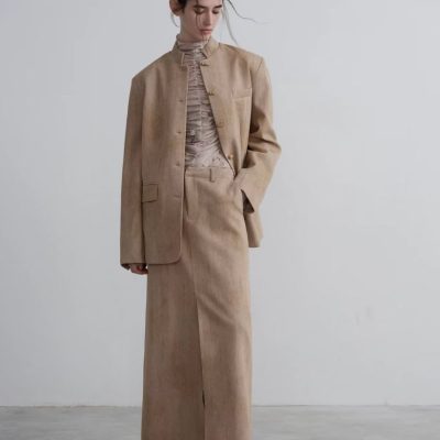 Cashmere beige women's business suit with blazer and long skirt, elegant professional attire, minimalist fashion style, suitable for office wear or formal occasions.