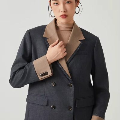 Stylish women's designer blazer with contrasting lapel and cuffs, perfect for professional and fashionable looks. Crafted for comfort and elegance, ideal for office or formal occasions.