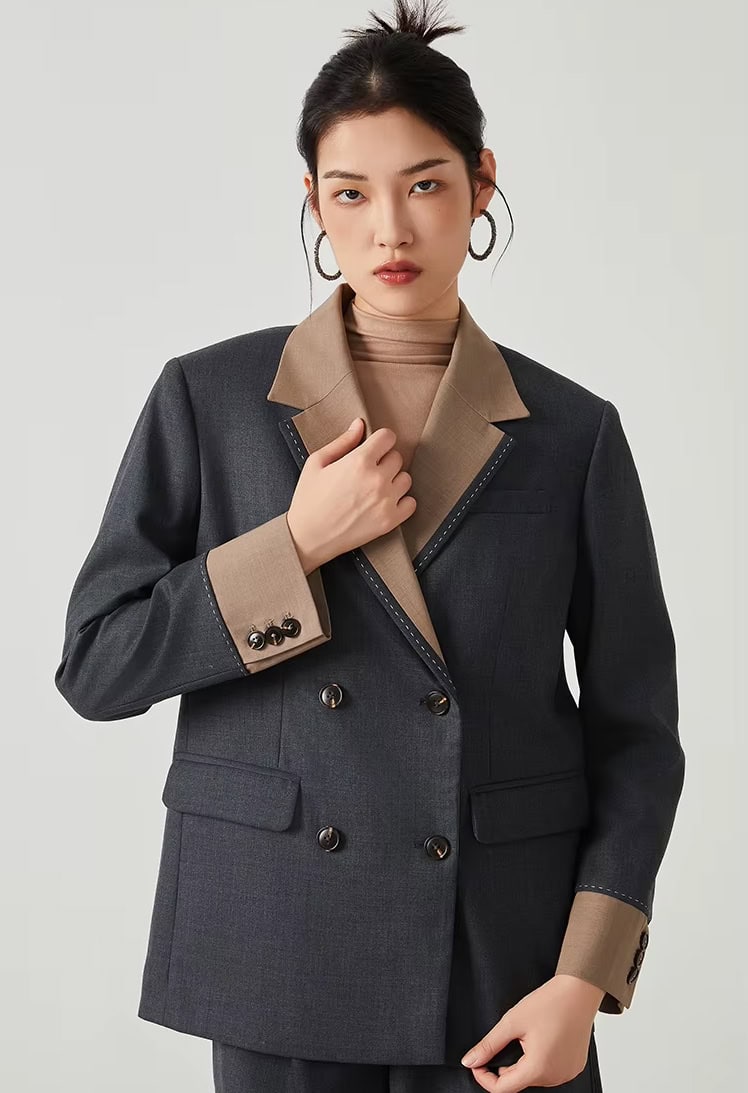 Stylish women's designer blazer with contrasting lapel and cuffs, perfect for professional and fashionable looks. Crafted for comfort and elegance, ideal for office or formal occasions.