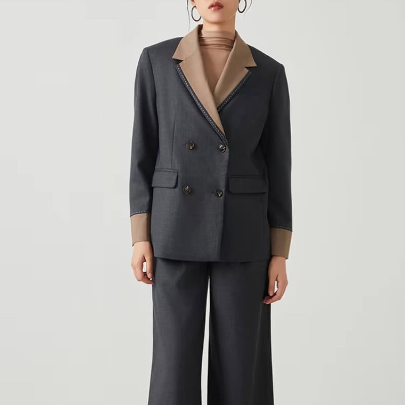 Elegant women's tailored business suit in dark gray with beige accents, perfect for professional attire and eyewear shopping at Monalisa Store.