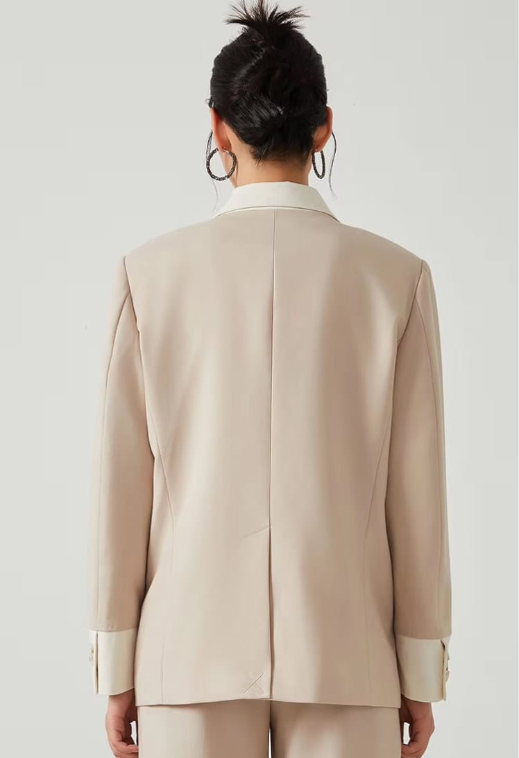 Elegant beige women's blazer with a tailored fit, perfect for professional and stylish office wear, featuring a classic lapel and comfortable design.
