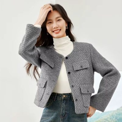 Elegant women's gray textured blazer with front pockets, perfect for stylish office wear and casual outings. Designed for comfort and sophistication, ideal for all seasons.