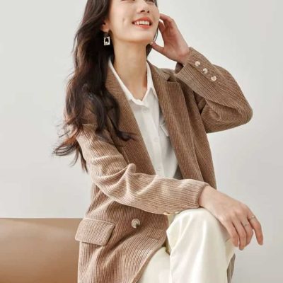 Elegant woman wearing stylish blazer and eyeglasses, showcasing fashionable optical accessories from Monalisa Store for a sophisticated look.
