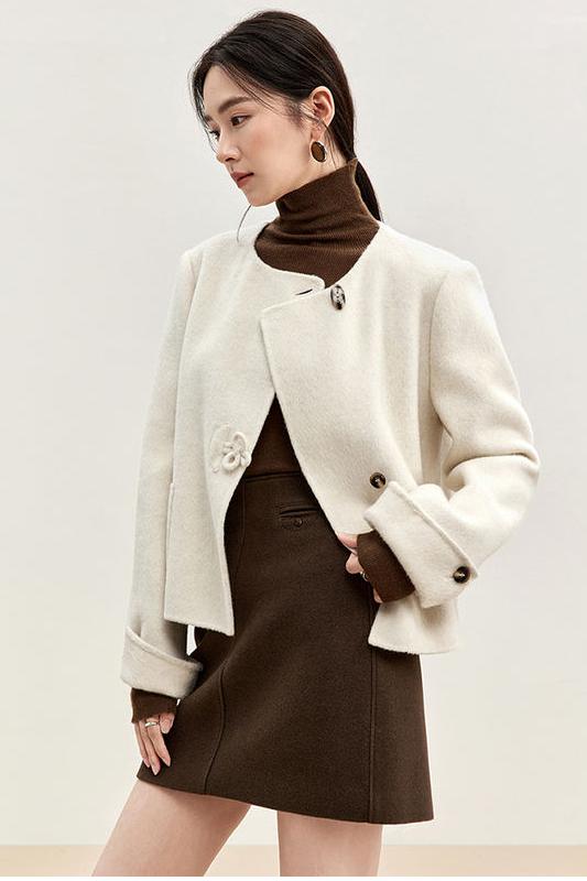 Modern woman's fashion with elegant cream jacket, stylish brown turtleneck, and fitted skirt, perfect for fall or winter wear. Explore Monalisa Store for trendy women's clothing and accessories.