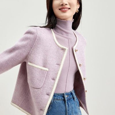 Elegant women’s pastel pink blazer with pearl trim, suitable for office or casual wear, enhancing your style. Perfect for fashion-conscious women seeking sophisticated, versatile outerwear.