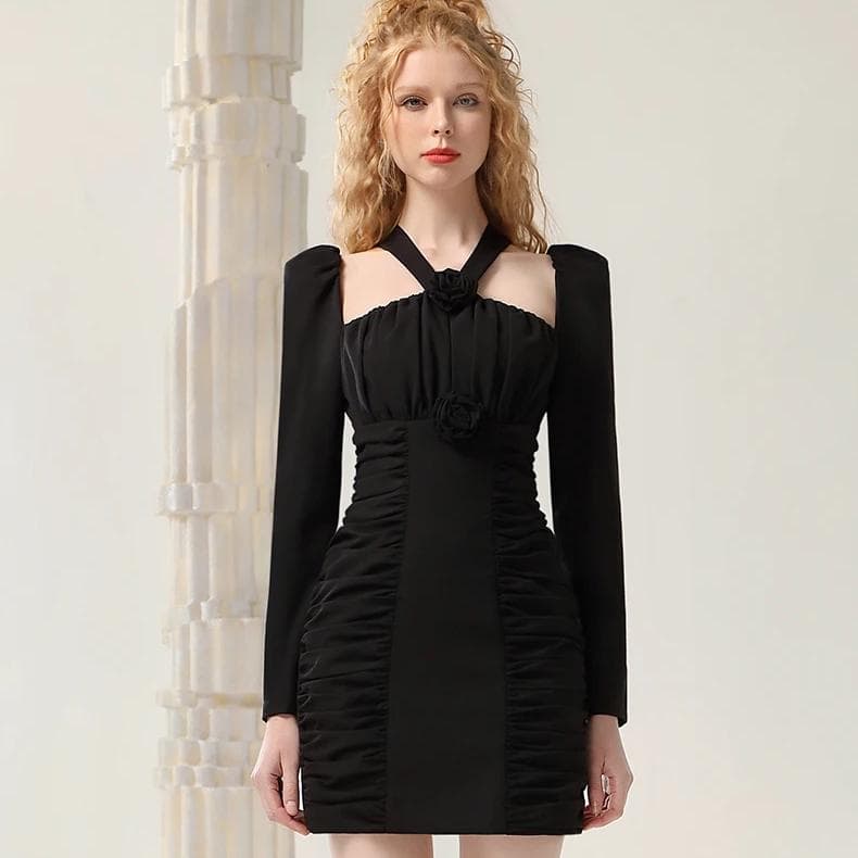 Elegant black dress with ruched details and floral accents, perfect for special occasions and evening wear. Designed for style and sophistication.