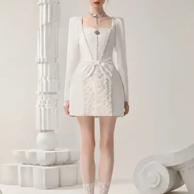 Elegant white dress with lace details, suitable for special occasions, featuring long sleeves, square neckline, and vintage-inspired accessories. Perfect for stylish women seeking fashionable attire.