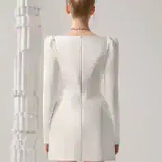 Elegant white dress with long sleeves and tailored design, ideal for fashion-forward occasions, available at Monalisa Store for stylish women.