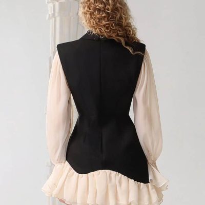 Elegant fashion model wearing a black sleeveless top with cream ruffled skirt, showcasing stylish modern clothing from Monalisa Store. Perfect for trendy urban looks.