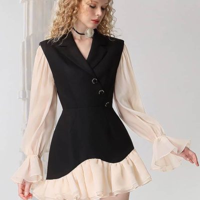 Elegant women's dress featuring a black fitted vest and ivory chiffon ruffled hem with long puff sleeves, perfect for stylish occasions.