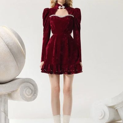 Luxurious red velvet dress with puff sleeves and ruffle hem, perfect for stylish occasions or boutique fashion collections. Elegant evening wear from Monalisa Store's latest collection.