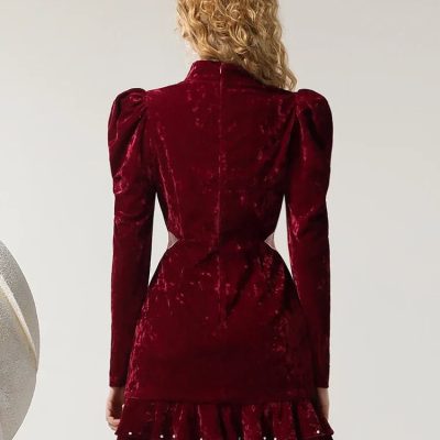 Luxurious red velvet dress with puffed shoulders and ruffled hem, perfect for elegant fashion, designer clothing, special occasions, and upscale wardrobes.
