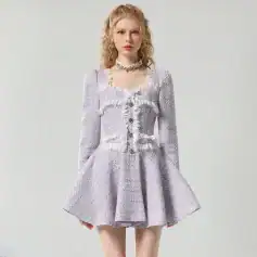 Elegant silver fashion dress with ruffle details and fitted bodice, perfect for upscale events or special occasions. Crafted from luxurious fabrics for a sophisticated look.