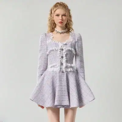 Elegant silver fashion dress with ruffle details and fitted bodice, perfect for upscale events or special occasions. Crafted from luxurious fabrics for a sophisticated look.