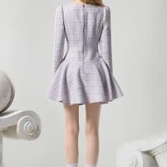 Elegant women's tailored tweed dress with a flared skirt, silver high heels, and stylish socks, showcased in a modern minimal setting at Monalisa Store, perfect for fashion-forward occasions.