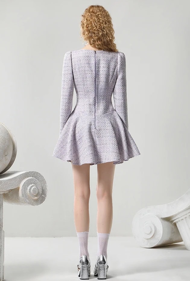 Elegant women's tailored tweed dress with a flared skirt, silver high heels, and stylish socks, showcased in a modern minimal setting at Monalisa Store, perfect for fashion-forward occasions.