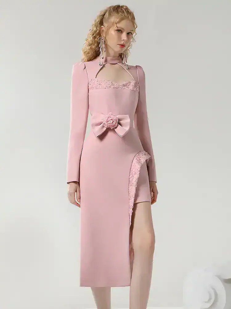 Elegant pink evening gown with lace details, bow accent, and high slit, perfect for formal occasions and weddings, available at Monalisa Medical Store.