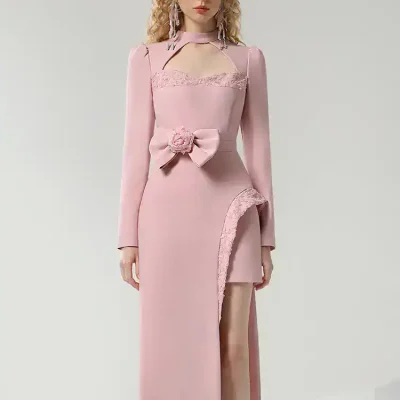Elegant pink formal dress with lace details and thigh-high slit, perfect for special occasions and events.