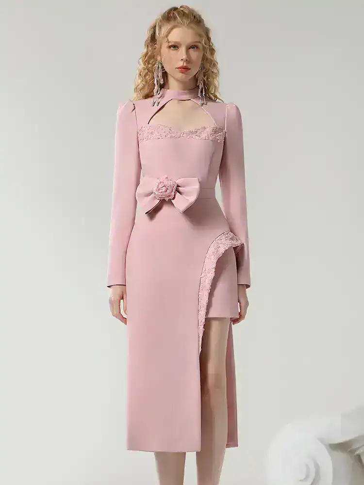 Elegant pink formal dress with lace details and thigh-high slit, perfect for special occasions and events.