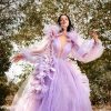 Luxurious lavender ball gown with floral embellishments, perfect for high-fashion events and photo shoots. Stunningly designed dress with sheer sleeves and intricate detailing from Monalisa Store.