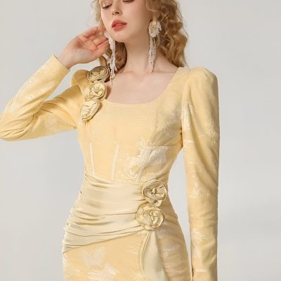 Elegant beige evening gown with floral embellishments and delicate fabric texture, ideal for special occasions at Monalisa Store, focusing on luxury women's fashion.