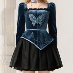 Elegant blue dress with butterfly embroidery, long sleeves, and a layered skirt, perfect for fashion-forward women and special occasions.