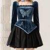Butterfly embroidery silk blouse and black pleated skirt fashion outfit at Monalisa Store for elegant women.