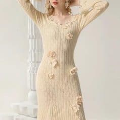 Soft beige knitted dress with floral appliqué details, perfect for elegant occasions and casual wear, available at Monalisa Store.
