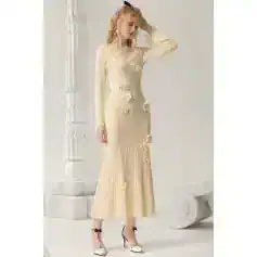 Elegant beige dress with floral embellishments, perfect for special occasions, designed for modern fashion enthusiasts.