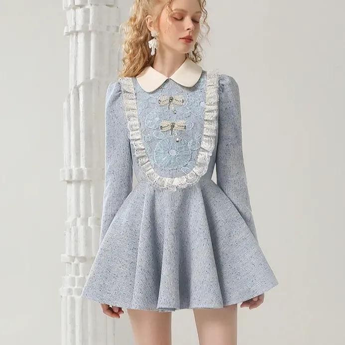 Luxurious pastel blue dress with intricate lace details, scalloped trim, and bow embellishments, perfect for elegant occasions at Monalisa Store.