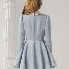 Elegant grey designer dress with a flared skirt, perfect for formal occasions or upscale events, showcasing stylish detailing and comfortable fit.