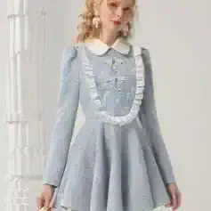 Luxurious light blue lace mini dress with puffed sleeves, ruffled detailing, and bow accents, perfect for elegant occasions or fashion-forward events.