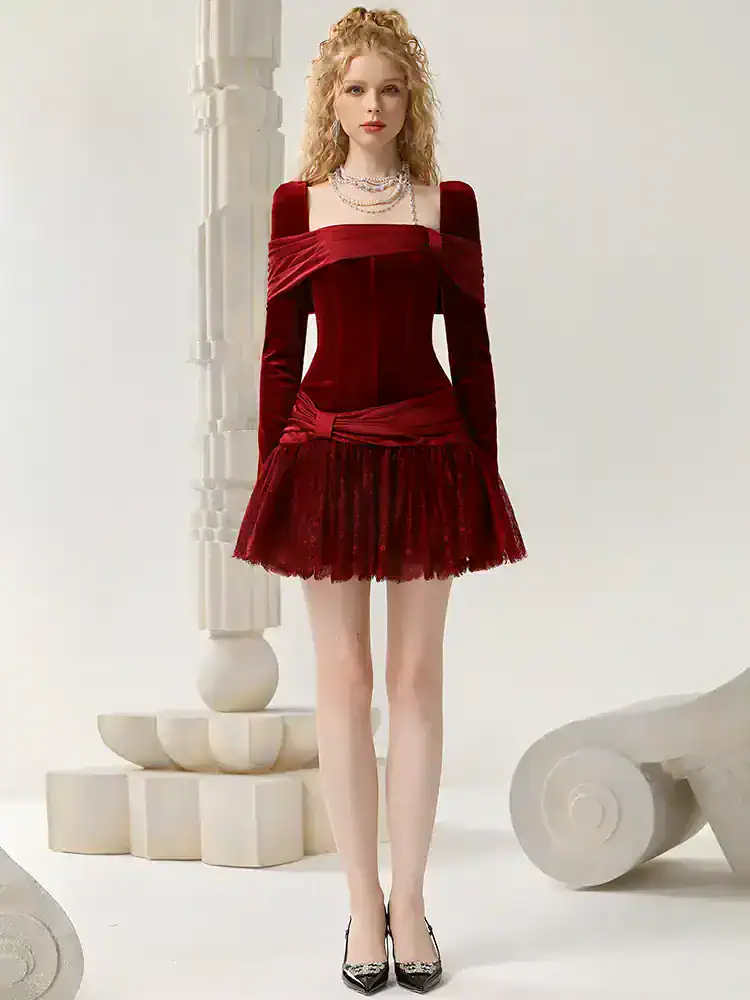 Elegant red velvet dress with off-shoulder design, layered skirt, and intricate detailing for formal occasions or special events. Perfect choice for fashion-forward women seeking luxury attire.