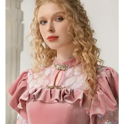 Elegant woman in pink dress with ruffles, lace, and floral embroidery, showcasing stylish fashion from Monalisa Store, perfect for special occasions or fashion-forward individuals.