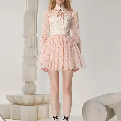 Elegant floral dress with high collar and bow detail, perfect for fashion-forward women, available at Monalisa Store.