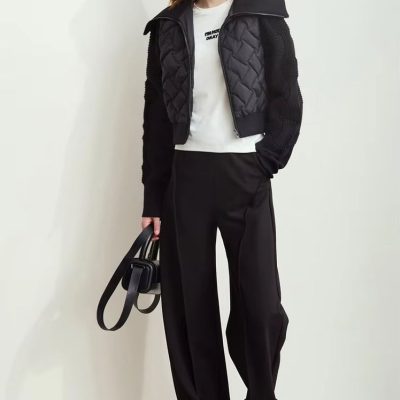 Stylish young woman in Monalisa Store sportswear, layered winter jacket, casual white t-shirt, black tailored pants, and sneakers, showcasing fashionable and comfortable clothing options.