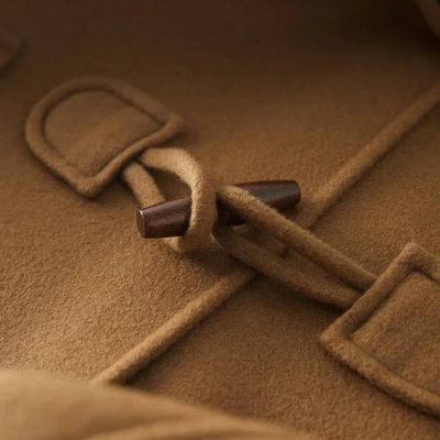 Monalisa Store warm camel-colored coat with toggle closure, showcasing quality craftsmanship and stylish outerwear for fall and winter.