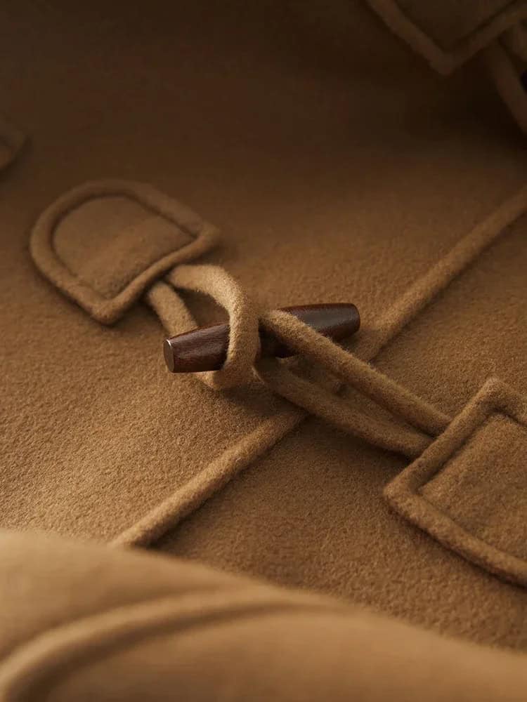 Monalisa Store warm camel-colored coat with toggle closure, showcasing quality craftsmanship and stylish outerwear for fall and winter.