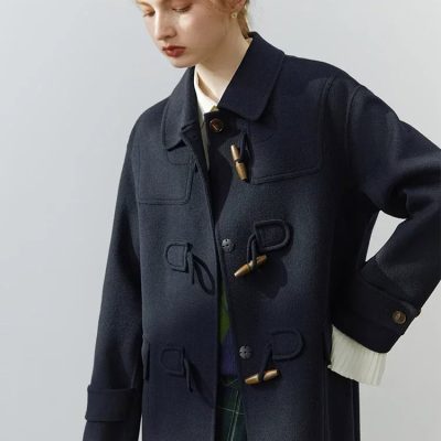 Elegant woman wearing a stylish black duffle coat with toggle closures, perfect for fall and winter fashion, showcased at Monalisa Store - your destination for trendy outerwear.