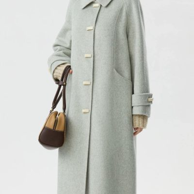 Luxurious light gray wool coat with oversized fit, classic collar, and stylish button details, perfect for elegant winter looks at Monalisa Medical Store.