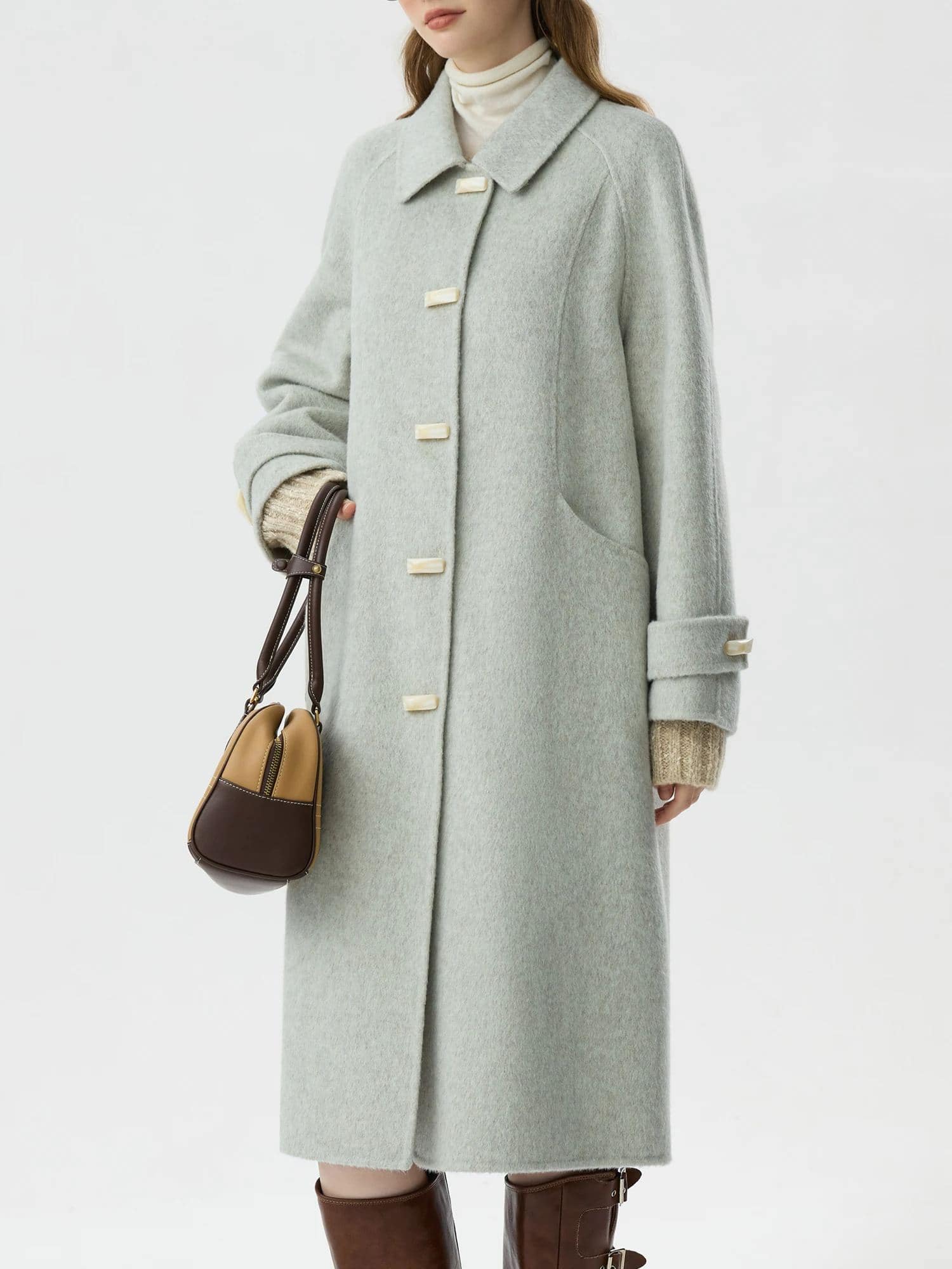 Luxurious light gray wool coat with oversized fit, classic collar, and stylish button details, perfect for elegant winter looks at Monalisa Medical Store.