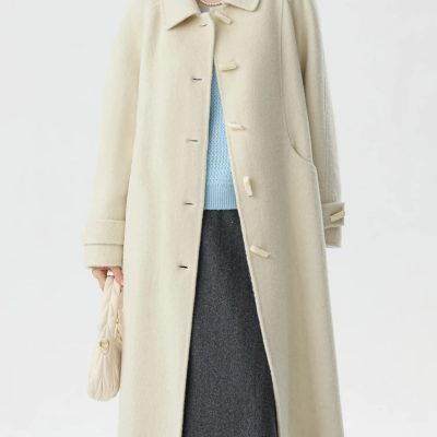 Luxurious cream-colored wool coat with classic design, oversized fit, and elegant button details, perfect for winter fashion at Monalisa Store.
