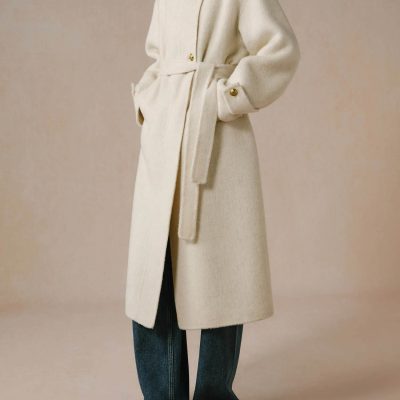 Luxurious cream-colored wool coat with gold button accents, stylish wrap design, and adjustable waist belt, perfect for cold weather, offered by Monalisa Medical Store.