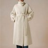 Luxurious cream wool coat with gold button accents and a waist belt, perfect for winter elegance and fashion statement.