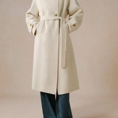 Luxurious beige wool coat with gold accents, high collar, and matching belt, perfect for winter fashion and elegant style.